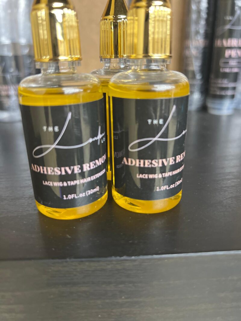 Adhesive removal oil